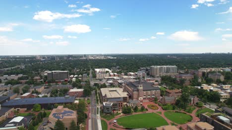 Drone-flying-low-to-historic-university-building-at-the-University-of-Denver-college-campus-in-Denver,-Colorado,-USA