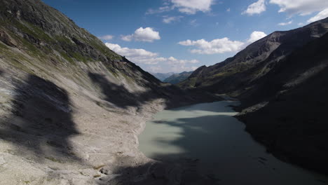 Pasterze-glacier-lake-at-the-foot-of-the-Grossglockner-Mountain-in-the-Austrian-Alps,-Drone-shot