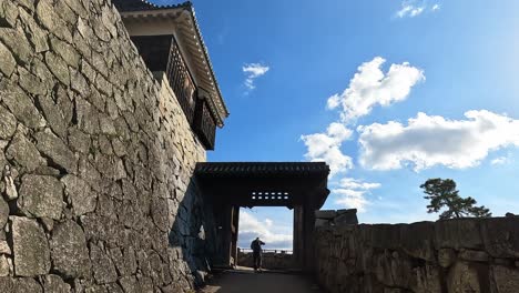 Revealing-shot-of-Matsuyama-castle-steep-stone-walls-,-samurai-castle-in-Matsuyama,-Japan