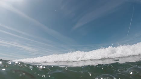 Side-View-as-Waves-Break-and-Camera-Goes-Underwater