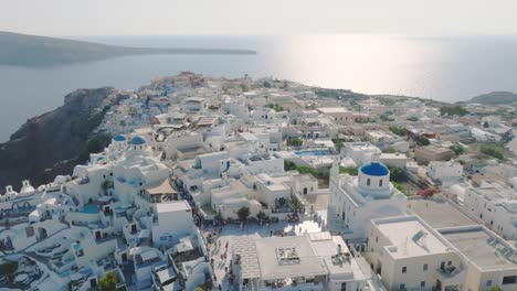 Immerse-yourself-in-Santorini's-vibrant-cultural-festivals,-alive-with-traditional-Greek-music-and-dance-from-above