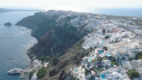 Watch-as-donkeys-navigate-the-island's-winding-paths,-providing-a-unique-perspective-of-Santorini's-charm