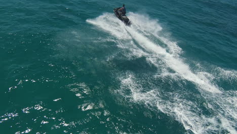 Jet-Skier-Riding-Jetski-In-The-Blue-Ocean---Water-Sport