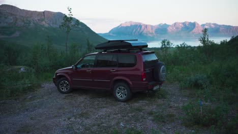 Camping-Car-Parke-In-The-Campground-With-Mountain-and-Lake-In-The-Background