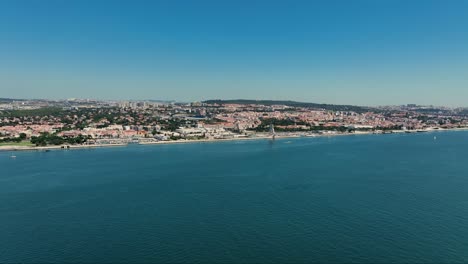 Drone-shot-from-crossing-over-river-tejo-from-Porto-Brandao-to-Lisbon
