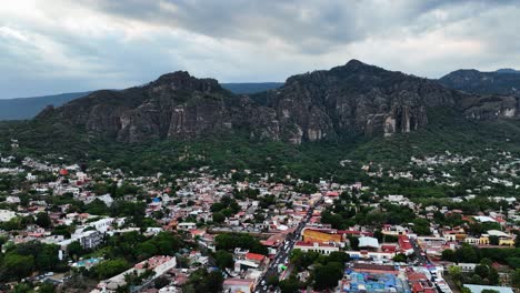 Aerial-view-flying-over-the-Tepoztlan-Magic-Town-in-Morelos,-cloudy-Mexico