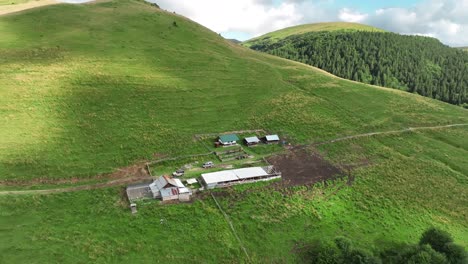 aerial-footage-of-a-village-in-a-mountain,-Sinaia,-Romania