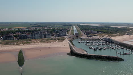 Aerial-View-of-Marina-And-Beach-In-Cadzand-On-A-Sunny-Day-In-Zeeland,-Netherlands