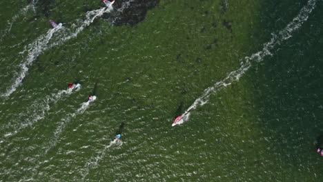 Top-View-Over-Tourists-Windsurfing-In-Brouwersdam-Beach,-Netherlands---drone-shot