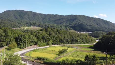 Slow-panning-shot-of-the-mountain-valley-that-encloses-Takeda-castle,-Japan