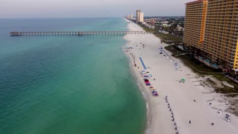 Panama-City-Beach-aerial-view-over-Gulf-of-Mexico-during-morning-dawn,-clear-blue-water-beach-of-Panhandle-Florida-America