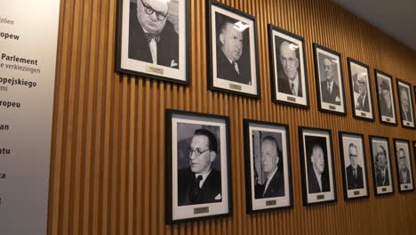 Slow-Pan-Right-View-Of-Wall-With-Photo-Portraits-Of-Past-European-Leaders