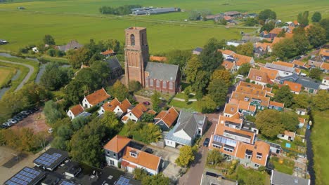Backward-travel-above-traditional-Dutch-village-Ransdorp-and-it's-spireless-church