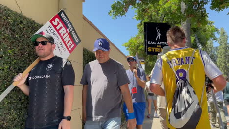 WGA-and-SAG-AFTRA-Strickers-Picketing-Alongside-Warner-Brothers-Studio-on-W-Olive-Ave