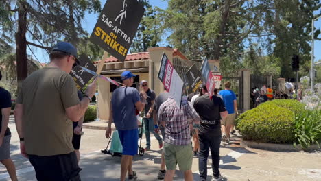 WGA-and-SAG-AFTRA-Strikers-Picketing-Outside-Warner-Brothers-Studio-Entrance-on-W-Olive-Ave