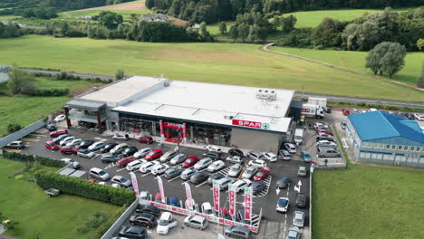 Drone-footage-of-the-store-and-the-full-parking-lot-in-front-of-it