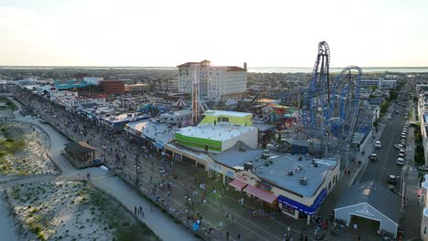 Seagulls-flying-over-boardwalk-at-sunset