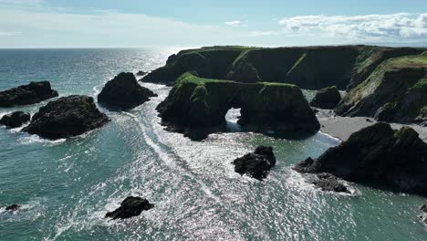 Coast-Ireland-sea-arch-and-sheltered-coves-on-the-copper-coast-Waterford-on-a-fine-summer-evening
