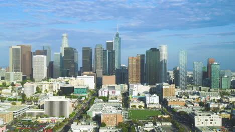 Slow-orbiting-shot-of-the-vast-skyscrapers-in-downtown-Los-Angeles-during-summer