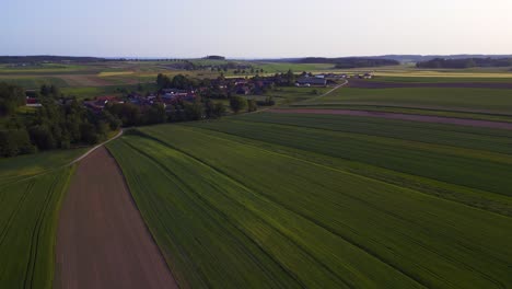 Fabulous-aerial-top-view-flight-Village-in-austria-Europe-field-meadow-road-sunset-summer-23