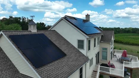 Solar-panels-on-large-American-home-in-rural-USA-countryside-with-orchard