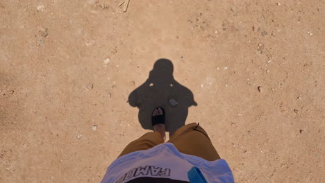 Capturing-a-First-Person-Perspective-in-Slow-Motion-Whilst-Walking-with-Shadows,-Filming-Feet-and-Legs