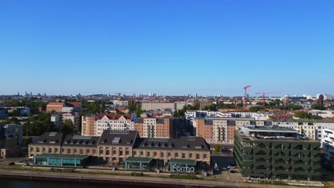 Wonderful-aerial-top-view-flight-harbor-building-on-border-river-Spree,-east-Berlin-Germany-evening-summer-23