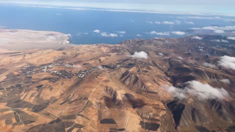 aerial-images-from-the-plane-of-the-island-of-Lanzarote,-timanfaya-national-park