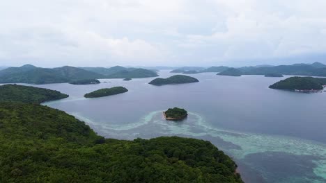 Aerial-seascape-view-of-remote-tropical-islands-and-coral-reef-ecosystem-in-remote-Coron-Bay,-Palawan,-Philippines