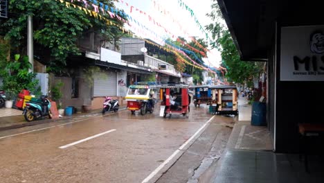 Colorful-Filipino-tricycle-taxis-during-Pintados-Kasadyaan-festival-celebrations-in-the-town-of-Coron,-Palawan-in-the-Philippines,-Southeast-Asia