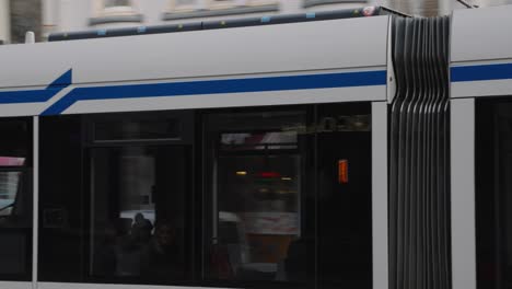 Tram-13-With-The-Sign-Of-Geuzenveld-In-Front-Traveling-At-A-Tramway-In-Amsterdam,-Netherlands