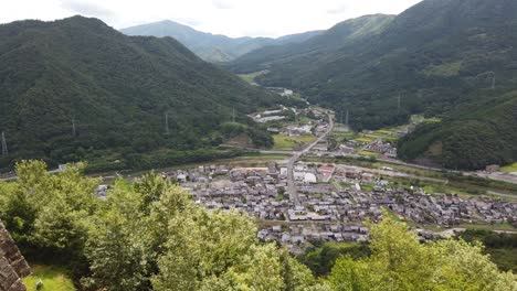 Sprawling-panoramic-overview-of-asago-valley,-japanese-village-on-overcast-day