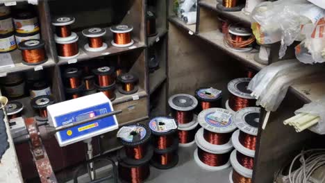 Coils-of-shiny-copper-on-the-shelf-in-close-up-view