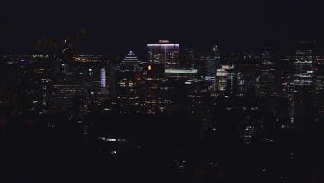 The-Skyline-of-Montreal,-Quebec,-From-the-Top-of-Mont-Royal-at-Night-with-Beautiful-City-Night-Lights