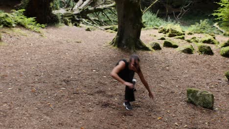 Joyful-teenage-girl-trying-out-capoeira-in-forest-meadow