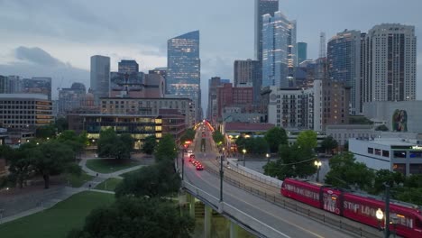 Trucking-forward-and-pedestaling-up-drone-shot-of-the-Houston-skyline-during-blue-hour