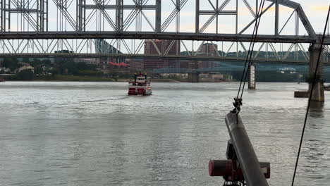 Cruise-Ships-Cross-Over-The-Ohio-River-And-Bridges-Connecting-Cincinnati,-Ohio,-And-Covington,-Kentucky-In-The-United-States
