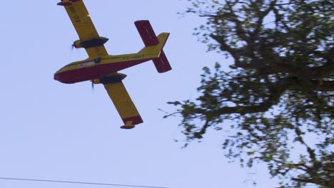 The-Canadair-CL-415-firefighting-aircraft-flies-low-over-the-fires