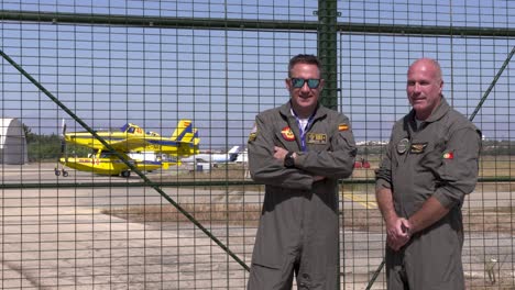 Two-pilots-of-the-AT-802A-air-tractor-firefighting-aircraft-in-the-background