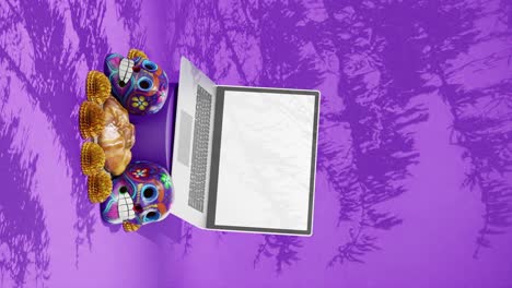 Day-of-The-Dead-Festival,-Dia-de-Muertos-,-Design-Mockup,-Laptop,-Template,-Mexico,-Skulls,-Traditional-Floral-and-Pastry,-Purple-Background,-Vertical