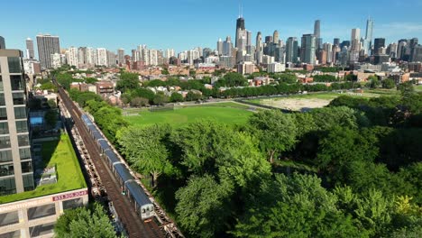 Chicago-elevated-train-traveling-on-tracks-in-suburb-during-summer