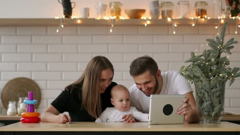 Parents-with-baby-boy-playing-with-digital-tablet