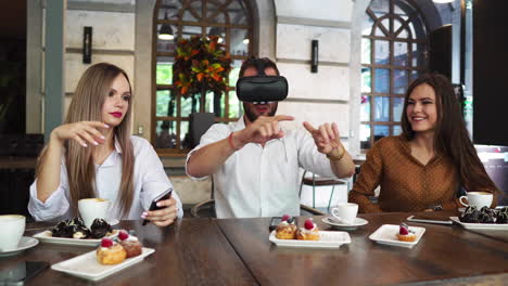 Team-of-developers-working-with-virtual-reality-glasses-during-a-business-meeting.-Young-business-colleagues-brainstorming-using-VR-goggles