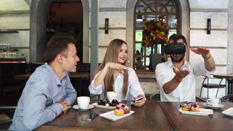 Team-of-developers-working-with-virtual-reality-glasses-during-a-business-meeting.-Young-business-colleagues-brainstorming-using-VR-goggles