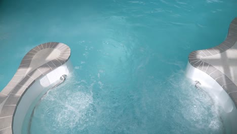 Slow-motion-revealing-shot-of-people-relaxing-in-the-Thalasso-spa-pool