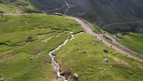 Motorcycle-trip-on-Transfagarasan-road-in-Carpathian-Mountains-Romania-Cinematic-drone-aerial-4K-video