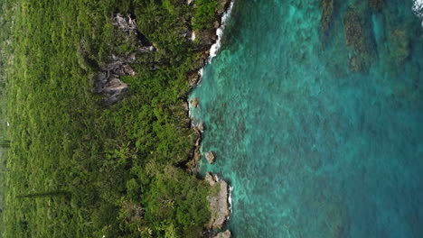 Aerial:-tropical-New-Caledonia-island,-Jokin-cliffs-and-Jokin-Bay,-vertical-format