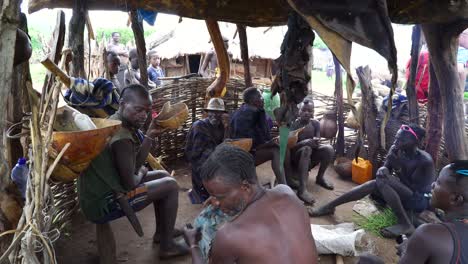 Close-Up-Of-Banna-Tribe-Men-Happily-Drinking-Coffee-In-Omo-Valley,-Ethiopia