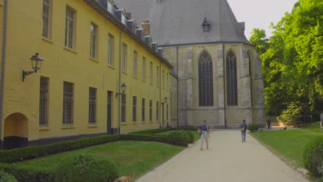 Tourists-taking-a-stroll-around-the-La-Cambre-Abbey-in-Brussels