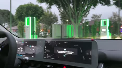 POV-Of-Driver-Pulling-Up-To-An-Electric-Vehicle-Fast-Charging-Station-In-Southern-California